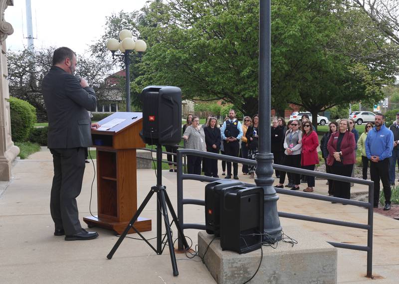 DeKalb County State’s Attorney Riley Oncken speaks to onlookers Wednesday, April 29, 2026, during Hands Around the Courthouse at the DeKalb County Courthouse in Sycamore. The event was held to mark Child Abuse Prevention Month.