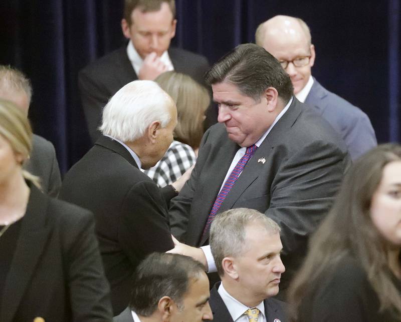 Illinois Gov. JB Pritzker greets people before President Joe Biden speaks at McHenry County College Wednesday, July 7, 2021, in Crystal Lake.