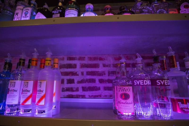 FILE - An empty space on a liquor shelf where Russian vodka used to be located at The Sidetrack, a gay bar on the north side of Chicago, July 29, 2013. The United States and Europe are slapping official sanctions on Russian banks and tech companies.  But bars and liquor stores across America and Canada have found another way to punish Russia for invading Ukraine: They’re pulling Russian vodka off their shelves and promoting Ukrainian brands instead. (AP Photo/Scott Eisen)
