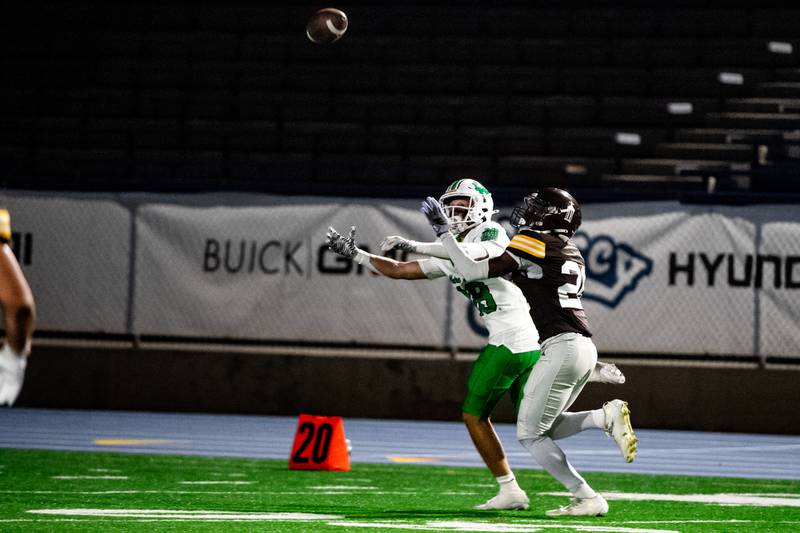 JCA's Kai Nathaniel breaks up a pass intended for Niles Notre Dame's Nick Miro during a game on Friday Oct. 3, 2025 at Busey Bank Field in Joliet