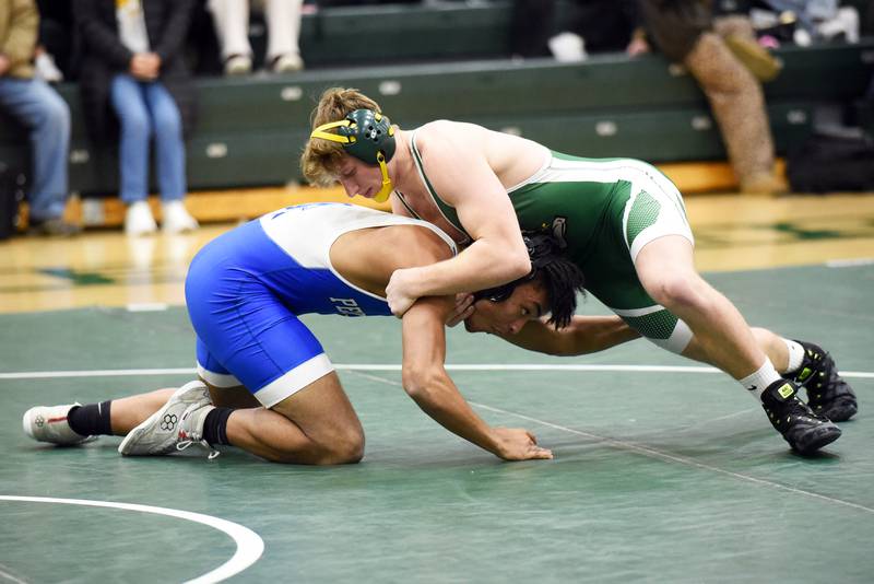 Coal City's Landin Benson, right, gets position on Peotone's Marcus Baker during the 175-pound match of Thursday's Illinois Central Eight Conference quad at Coal City. Benson and the Coalers earned a 79-0 win over Peotone and a 76-0 win over Lisle.