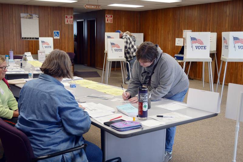 Jane Koeller fills out paperwork to receive her ballot to vote in the consolidated election in the Forreston Township building on April 4, 2023. About 80 people had voted in the precinct as of 3:06 p.m.