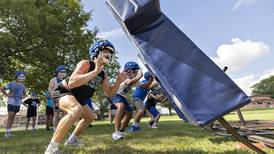 Photos: Newman football takes the practice field