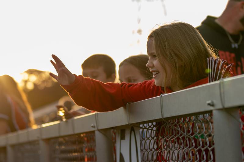 Ellianna Olson waves at hall football players before their game on Friday, Sept 5, 2025 at Richard Nesti Stadium in Spring Valley.