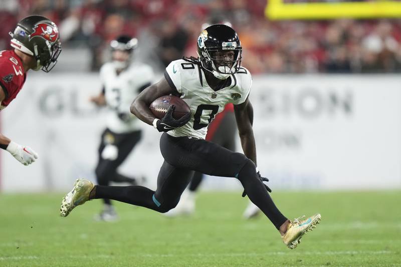 Jacksonville Jaguars wide receiver Calvin Ridley runs after a catch against the Tampa Bay Buccaneers, Sunday, Dec. 24, 2023, in Tampa, Fla.