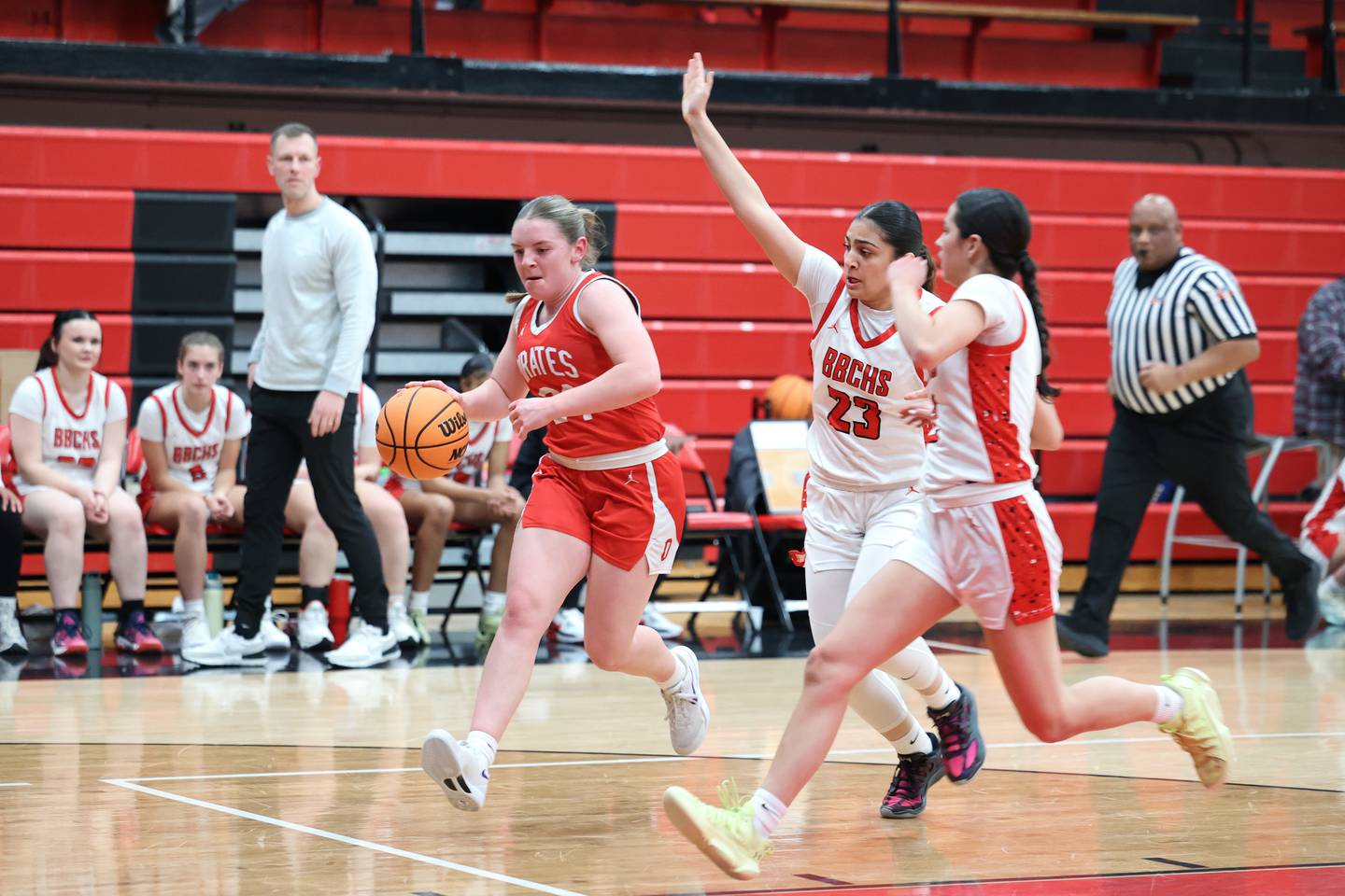 Ottawa's Kennedy Kane drives to the basket as Bradley-Bourbonnais' Semma Mohammad (23) and Abby Bonilla rush to defend during Ottawa's 55-44 victory on Monday, Feb. 9, 2026.