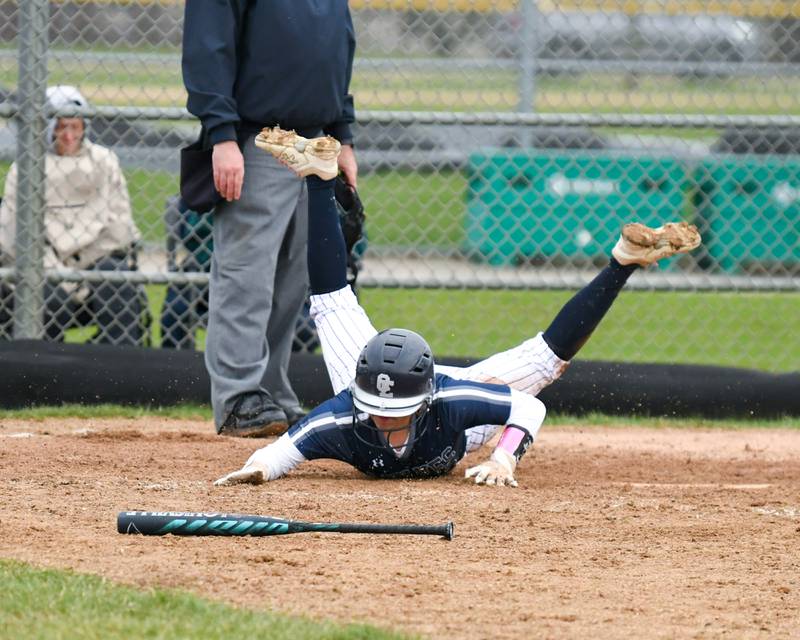 Oswego East’s Maya Bobo (0) slides into home plate during the game on Thursday April 17, 2025, while taking on Plainfield North held at Oswego East High School