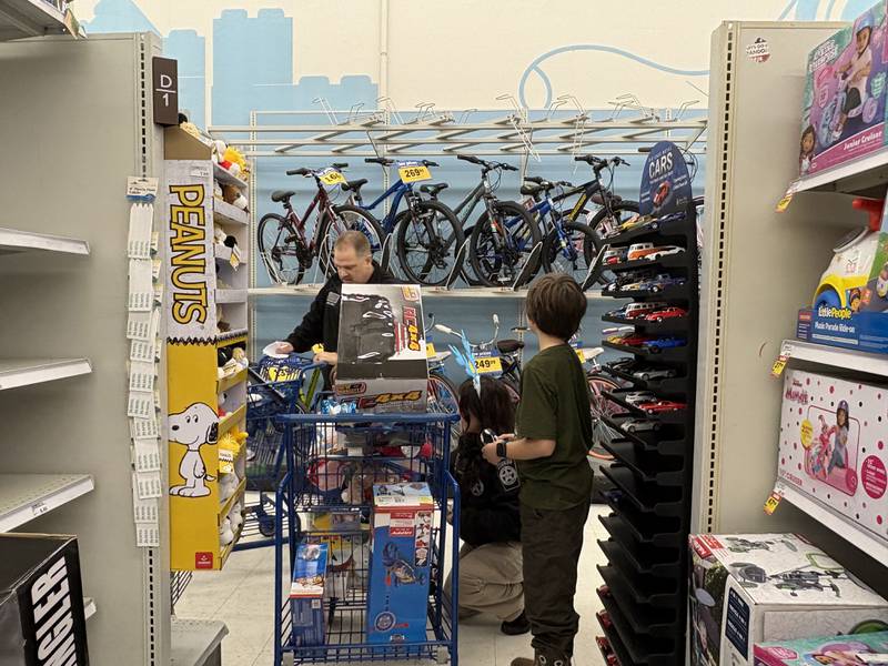 Kids and police officers check out the toy section at the McHenry Meijer during Shop with a Cop Dec. 8, 2024.