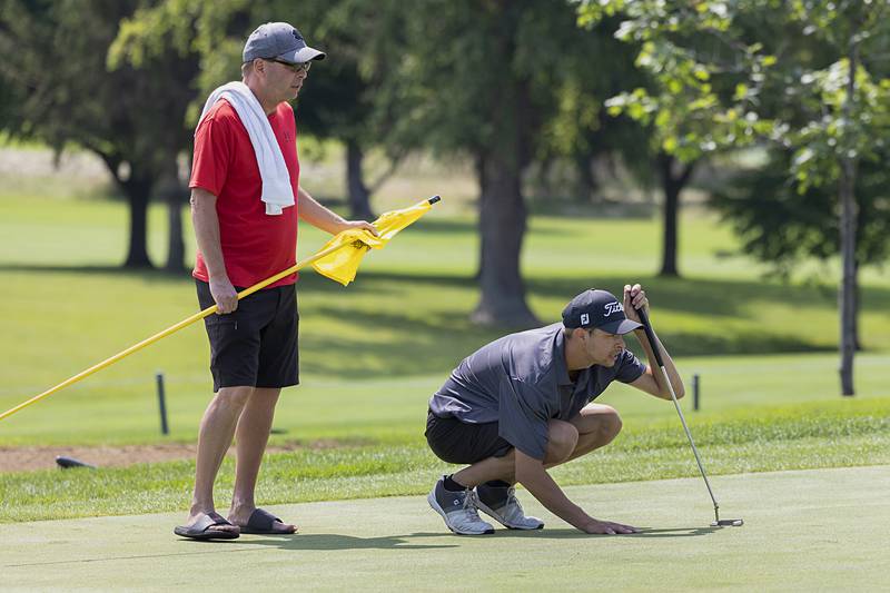 Adam Marshal lines up a putt on the 3rd green Sunday, July 21, 2024 during the final round of the 102nd Lincoln Highway golf tournament. The tournament was held at Emerald Hill in Sterling.
