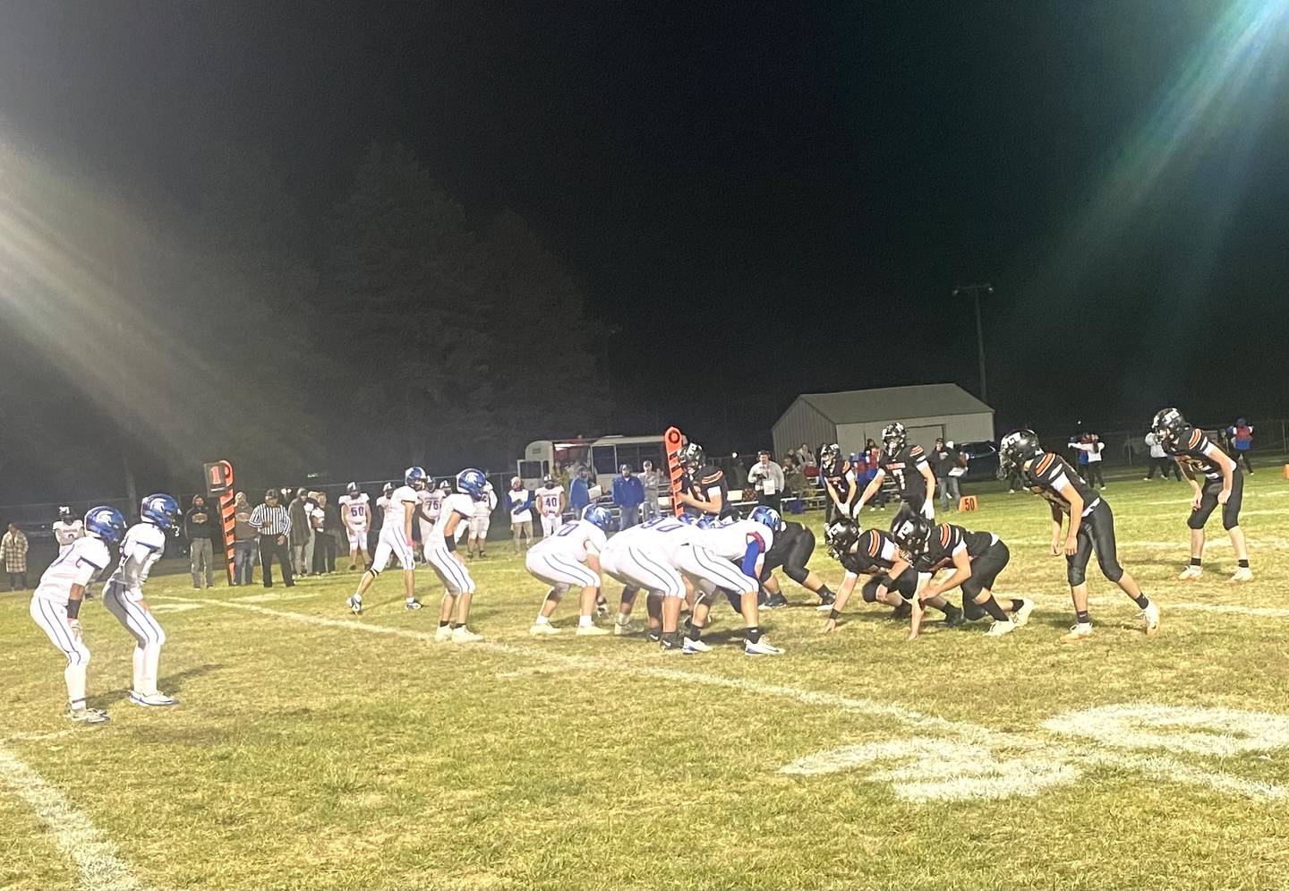 The FCW defense (at right) lines up against Bushnell-Prairie City on Friday, Oct. 24, 2025, in Flanagan.