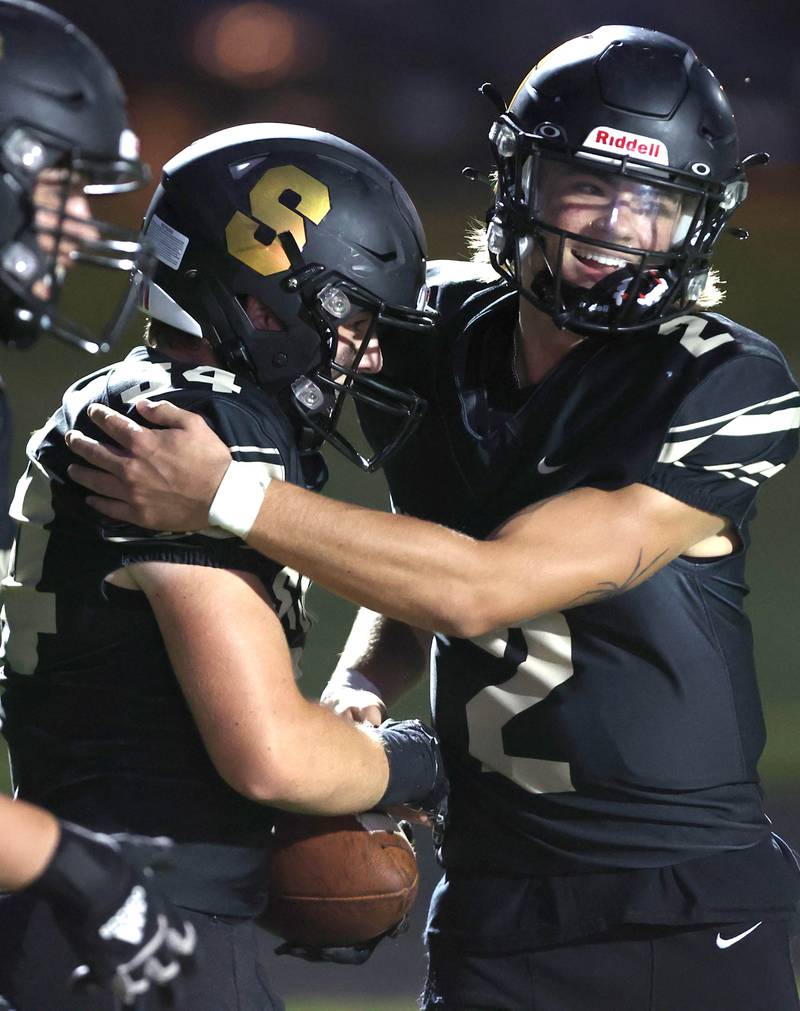 Sycamore's Joey Puleo and Elijah Meier celebrate their touchdown pass during their game against Ottawa Friday, Sept. 16, 2022, at Sycamore High School.