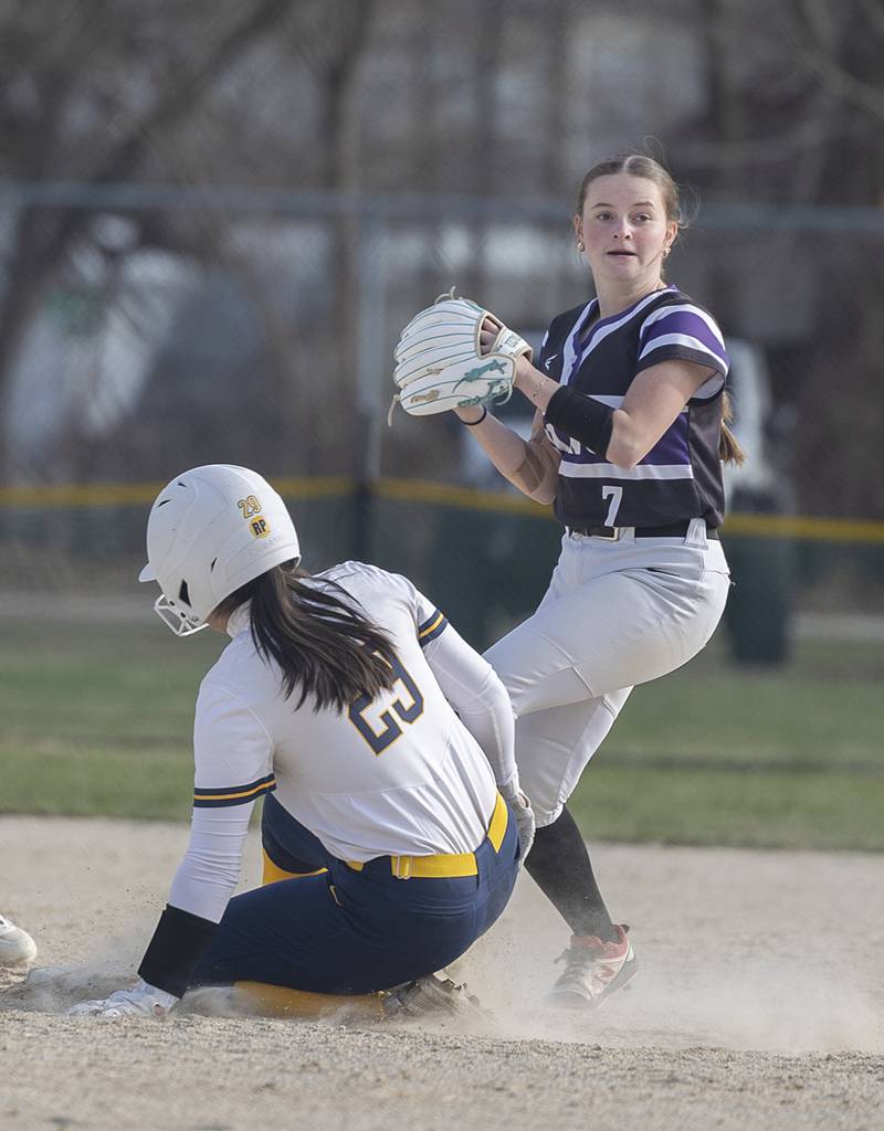 Dixon’s Brooklyn Tegeler looks to first after getting the force out at second on Sterling’s Olivia Castillo Tuesday, March 24, 2026.