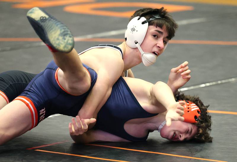 DeKalb’s Eduardo Castro wrestles Naperville North’s Ben Messier in a 113 pound semifinal match Friday, Jan. 20, 2023, during the DuPage Valley Conference wrestling tournament at DeKalb High School.