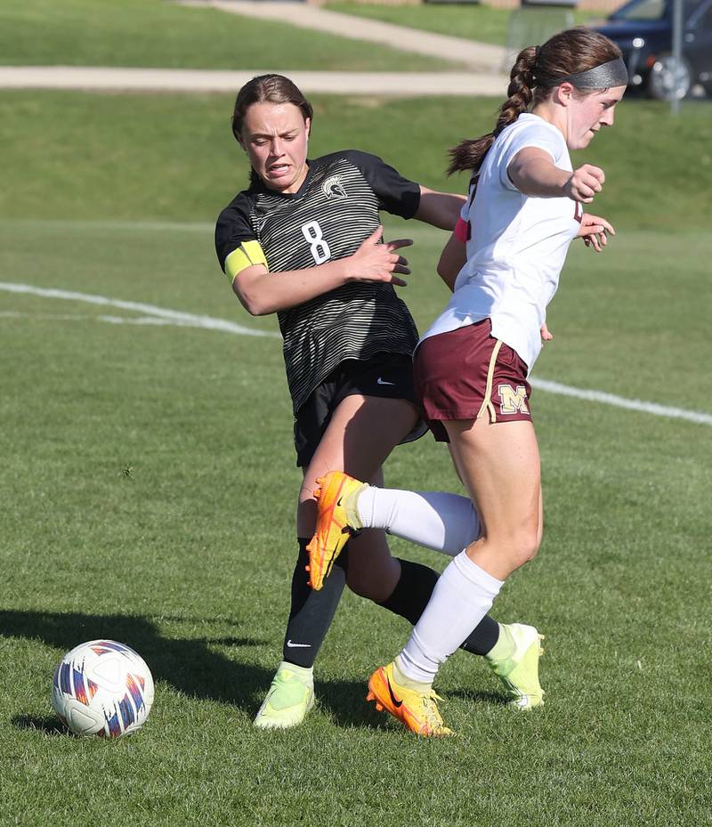 Sycamore's Anna Lochbaum kicks the ball away from Morris' Ella McDonnel during their Interstate 8 Conference Tournament semifinal game Wednesday, May 3, 2023, at Sycamore High School.
