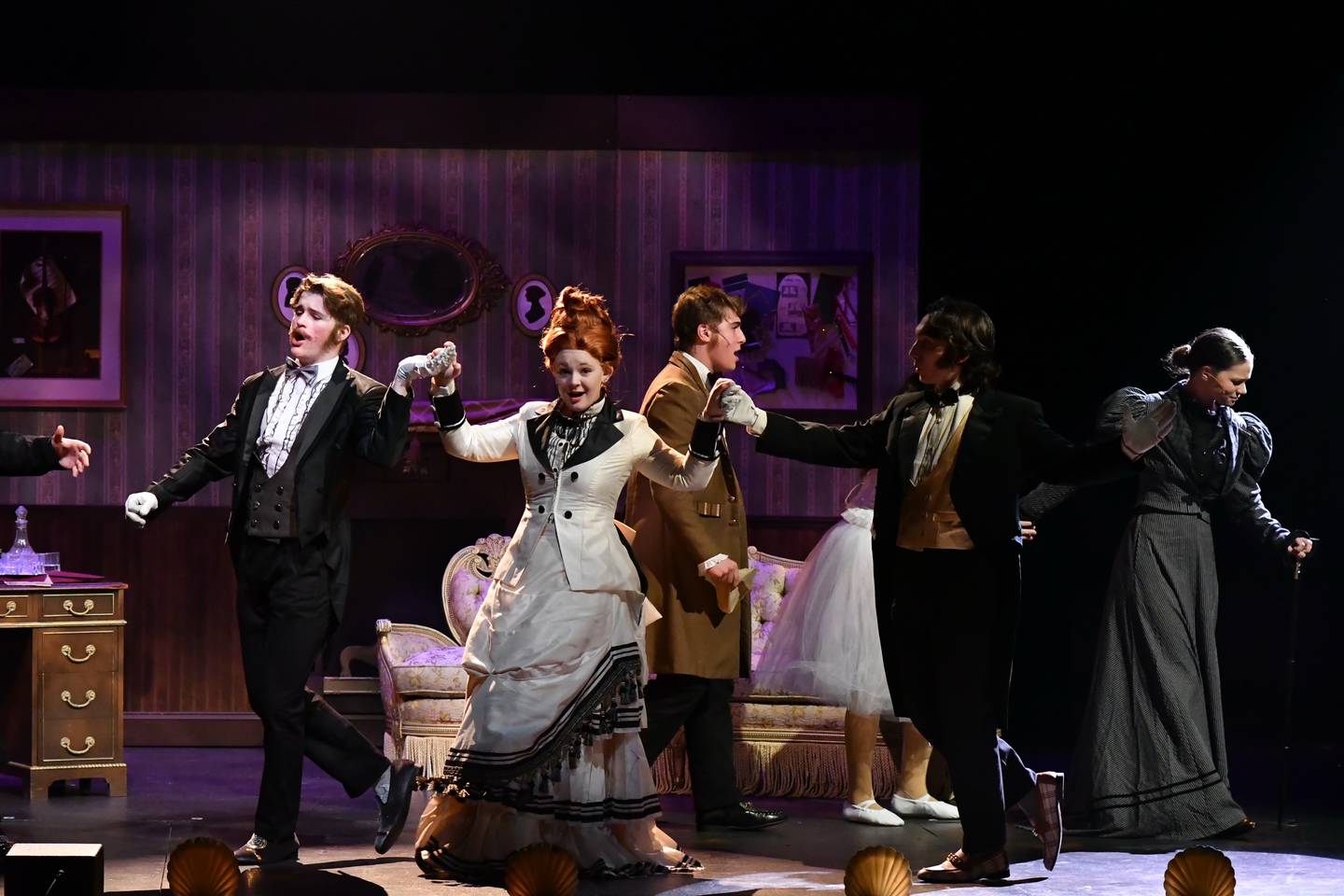 Senior Chloe Peacock (center) in the role of leading soprano, Carlotta