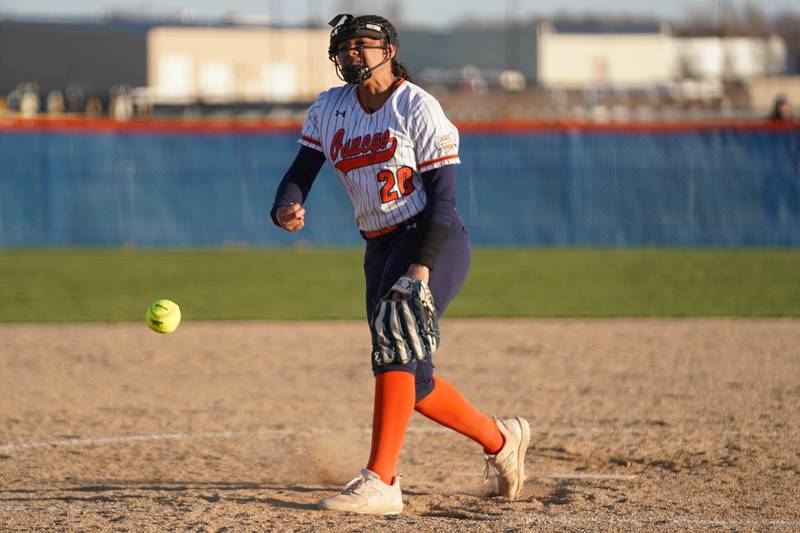 Oswego’s Jaelynn Anthony (20) delivers a pitch against Downers Grove South during a softball game at Oswego High School on Tuesday, March 19, 2024.