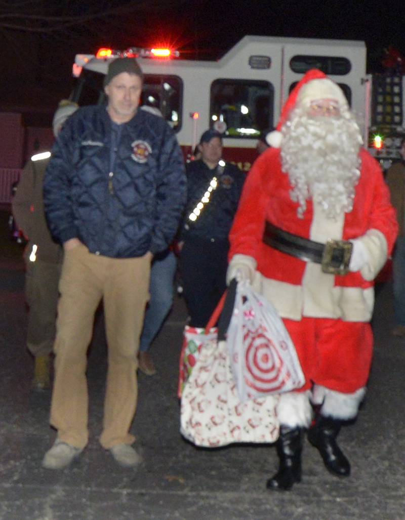 Santa arrives with the help from the Spring Valley Fire Dept.