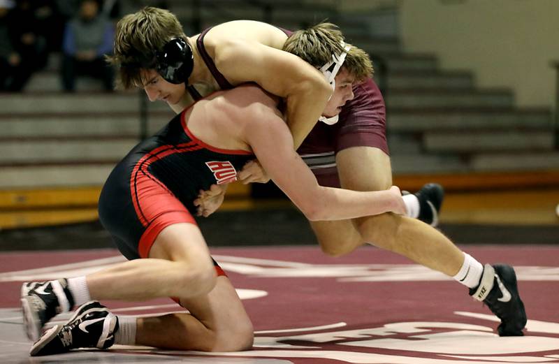 Huntley’s Griffin Guenther takes down Prairie Ridge’s Andrew Cioper on the way to pinning him during the 150-pound match of a Fox Valley Conference boys wrestling meet on Thursday, Jan. 22, 2026, at Prairie Ridge High School Crystal Lake.