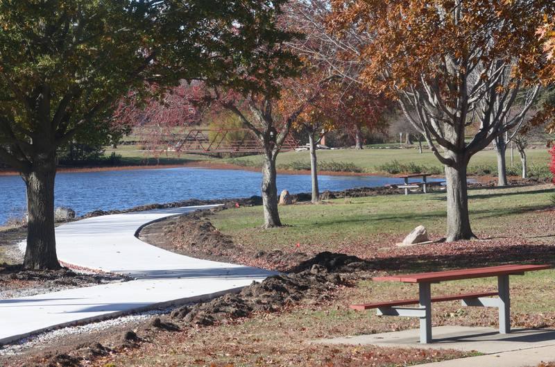 A view of a partial completed walkway around Baker Lake on Monday, Nov. 10, 2025 in Peru. The walking path is nearly half poured. It's been one-month since construction began. Work includes a 10-foot wide concrete path with secondary concrete paths also added, connecting with the new parking lot near Lighted Way and connecting with the parking lot, playground, and shelter on the west side of Baker Lake. The new path will be wider by 2 feet than the current one. The park remains closed to the public. The project will be completed in early December.