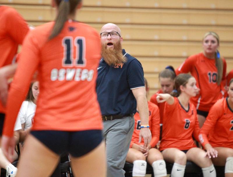Oswego’s head coach Chase Mang walks the sideline during a game Wednesday, Sept. 18, 2024 at St. Charles North.