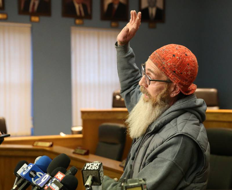 La Salle resident Jamie Hicks speaks out to the media about his home and yard that is covered in a substance from the Carus Chemical plant on Wednesday, Jan. 11, 2023 at La Salle City Hall.