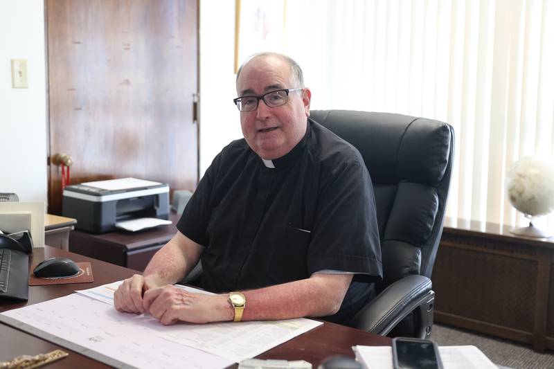 Rev. Tim Andres, the outgoing pastor of St. Joseph's Church, poses for a photo on Wednesday June 26, 2024 in Joliet.