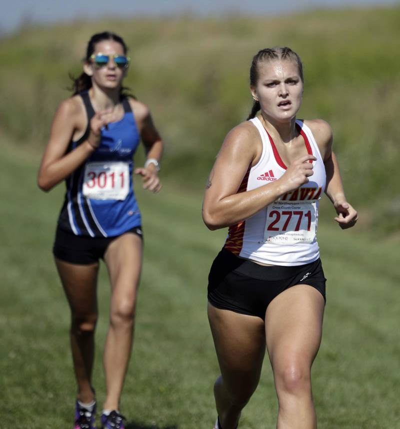 Brian Hill/bhill@dailyherald.com
Batavia's Liliana Bednarek and St. Charles North's Norah Dorrance at the Kane County cross country meet Saturday August 27, 2022 at Northwestern Medicine Field in Geneva.