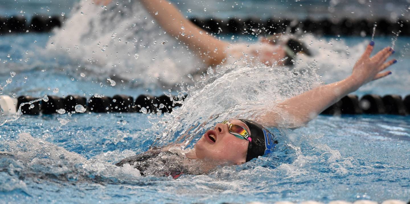 St. Charles North’s Isabelle Beu swims backstroke in the 200-yard individual medley during the IHSA girls state swimming finals at FMC Natatorium in Westmont on Saturday, Nov. 12, 2022.