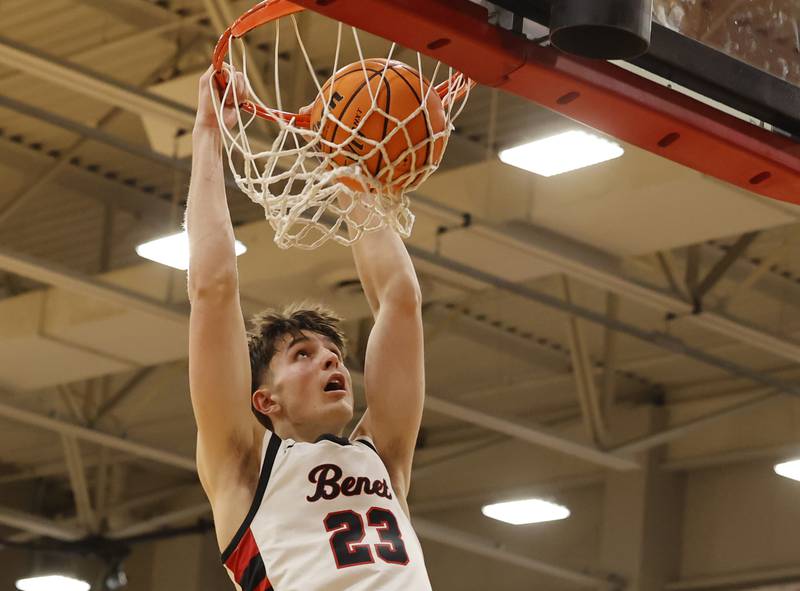 Benet's Edvardas Stasys (23) throws down a dunk during the When Sides Collide Shootout basketball tournament between Benet Academy and Warren Township high schools on Saturday, Jan. 24, 2026 in Lisle, IL.