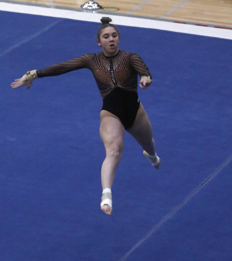 St. Charles North's Rachel Nicastro competes in the preliminary round of the floor exercise Friday, Feb. 17, 2023, during the IHSA Girls State Final Gymnastics Meet at Palatine High School.