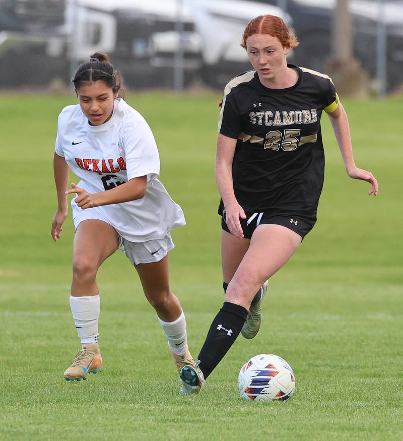DeKalb's Evelyn Guerra Cruz and Sycamore's Isabelle Segreti chase down a loose ball Thursday, May 7, 2026, during their game at Sycamore High School.