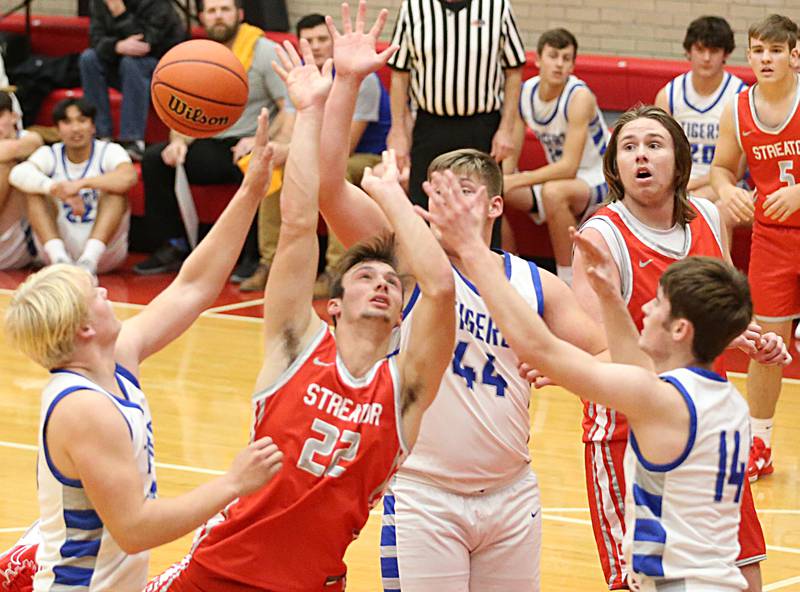 Streator's Christian Benning (22) looses control of the ball in the lane against Princeton during the Dean Riley Shootin’ The Rock Tournament on Monday, Nov. 21, 2022 at Kingman Gymnasium