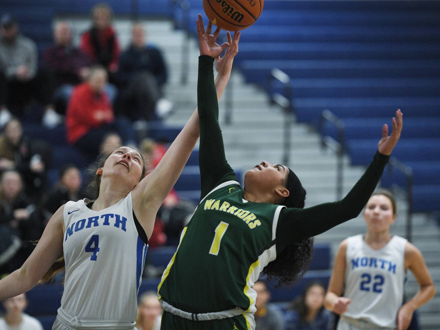 John Starks/jstarks@dailyherald.com
Wheaton North’s Elsa Carlson and Waubonsie Valley’s Arianna Garcia-Evans stretch for a rebound at the Wheaton North girls basketball tournament on Tuesday, December 27, 2022.