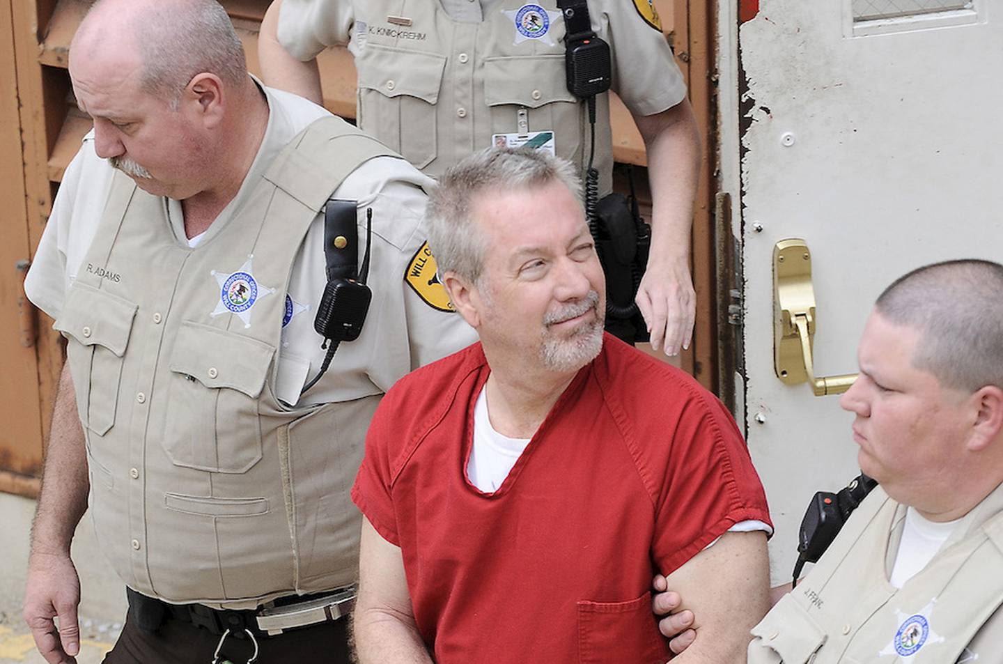 Drew Peterson is led out of the Will County Courthouse in Joliet after his first court appearance on murder charges in May 2009. Peterson is facing new charges that he tried to solicit someone to murder Will County State's Attorney James Glasgow.