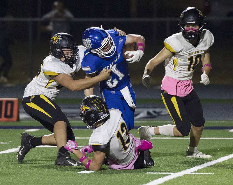 Newman’s Briar Ivey is hauled down after picking up yards against Riverdale Friday, October 11, 2024, in Sterling.