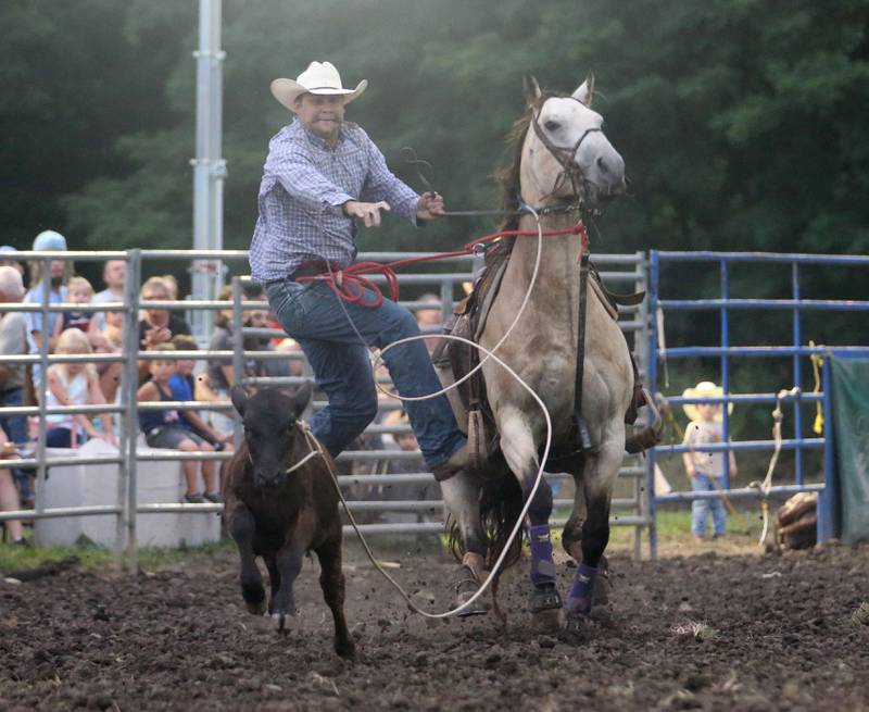 Lane Howard of Sheridan, competes in the Tie-down Roping during the Broken Horn Rodeo at the La Salle County 4-H Show and Junior Fair on Friday, July 14, 2023 in Ottawa.
