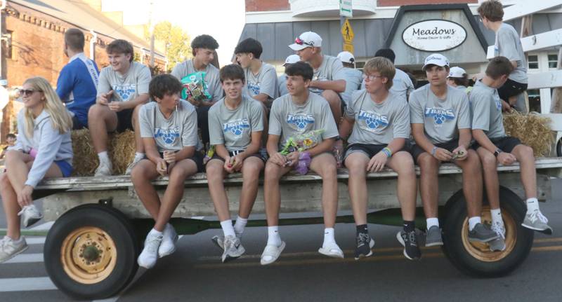The Princeton High School golf team rides during the homecoming parade on Thursday, Sept. 25, 2025 along South Main Street in Princeton .