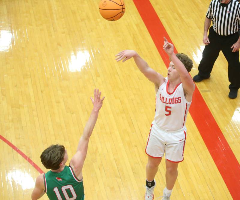 Streator's Isaiah Weibel lets go of a three point basket over L-P's Braylin Bond during the Class 3A Regional title game on Friday, Feb. 28, 2025 in Sellett Gymnasium at L-P High School.