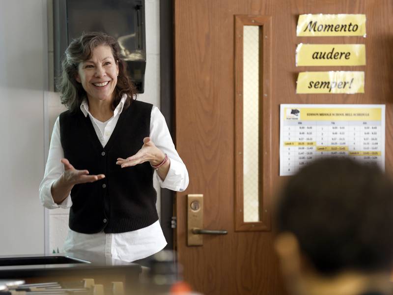 Daily Herald Top Teacher Amy Schwartz works with her eighth-grade students at Edison Middle School in Wheaton.
