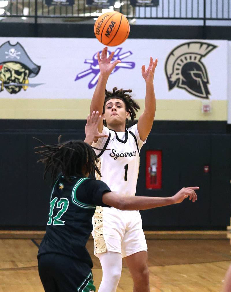 Sycamore's Josiah Mitchell shoots a there pointer over North Boone's Jaziah Howard during their game Tuesday, Dec. 3, 2024, at Sycamore High School.