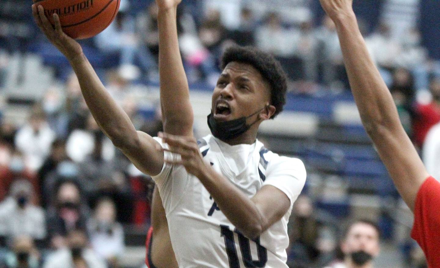 Oswego East’s DeVon Oregon gets the ball to the basket during a home game against West Aurora on Friday, Jan. 28, 2022.