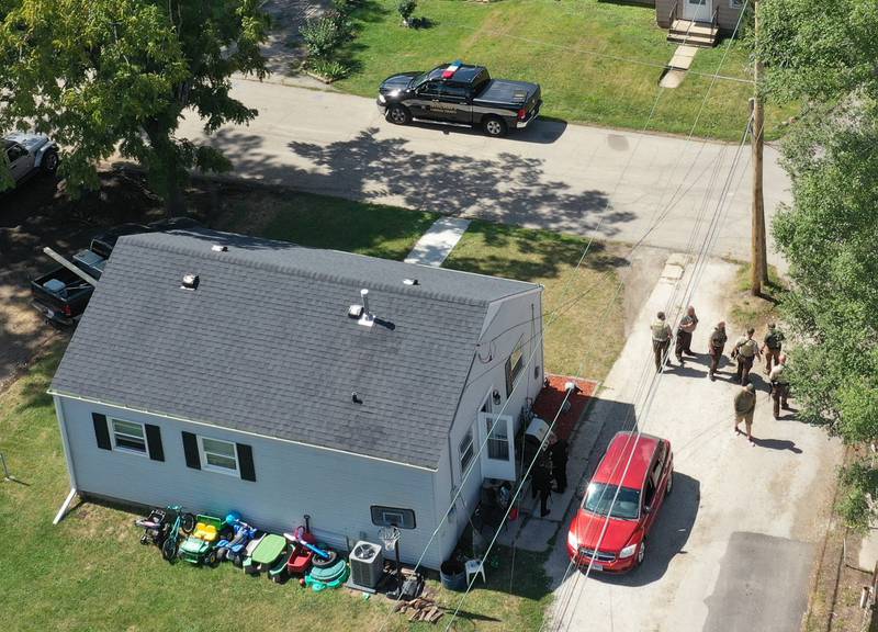 Ottawa Police and La Salle County Sheriff deputies surround a home in the 1500 block of Scott Street just south of U.S. 6 on Wednesday, Sept, 13, 2023 in Ottawa. A suspect had nearly an hour standoff with police around noon and was taken into custody around 1p.m.