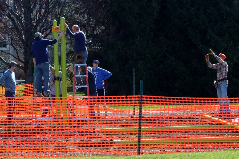 Volunteers and friends of Three Oaks Elementary School constructed a new playground at the Cary school on Saturday.