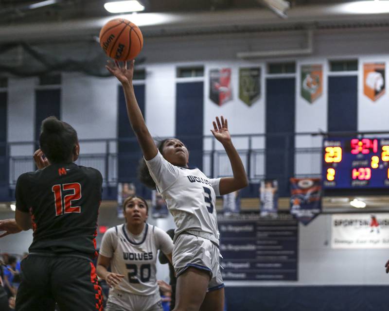 Oswego East's Avaya Kittling-Turner (3) puts up a shot during their basketball game between Minooka at Oswego East Friday, Jan 16, 2026 in Oswego.