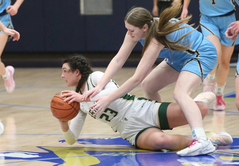 St. Bede's Ali Bosnich picks up a loose ball as Marquette's Kelsey Cuchra defends during the Class 1A Regional semifinal game on Monday, Feb,. 12, 2024 in Bader Gym.
