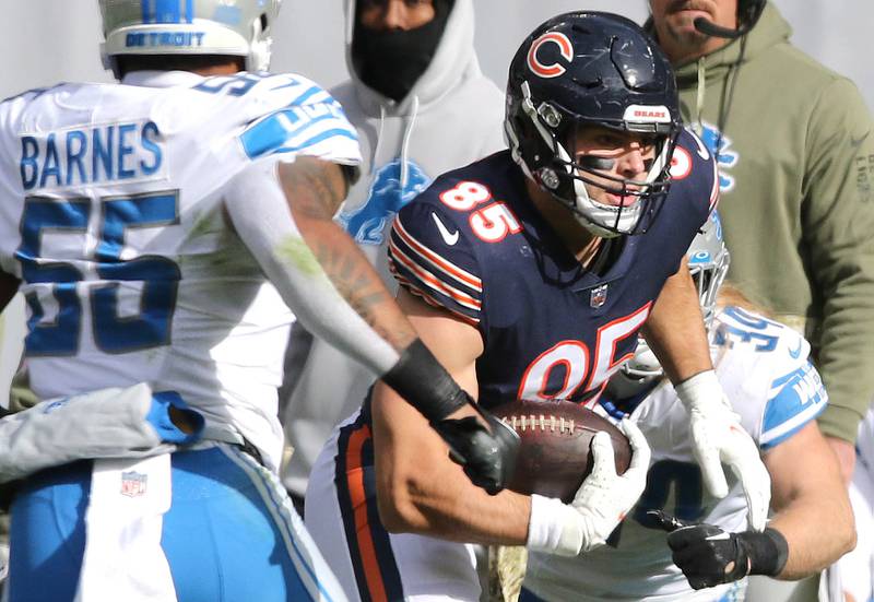 Chicago Bears tight end Cole Kmet gets between Detroit Lions linebacker Derrick Barnes and linebacker Alex Anzalone during their game Sunday, Nov. 13, 2022, at Soldier Field in Chicago.