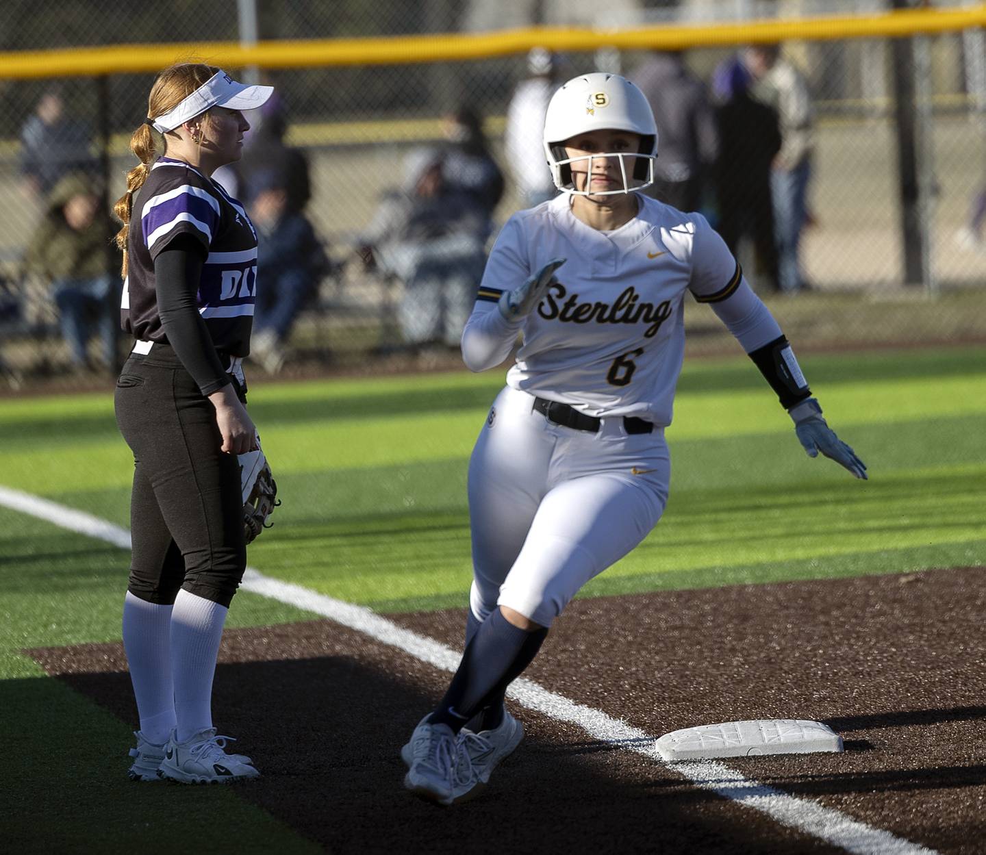 Sterling’s Dasia Lewis rounds third to score against Dixon Tuesday, March 25, 2025.