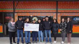 Rochelle presents facade grant to Tecalitlan Restaurant