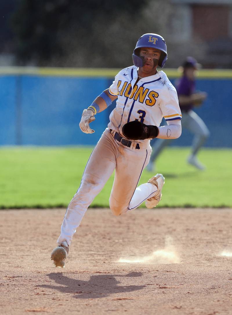 Lyons Township's Frederick Ragsdale III (3) rounds second during the boys varsity baseball game between Lyons Township and Downers Grove North high schools in Western Springs on Tuesday, April 11, 2023.