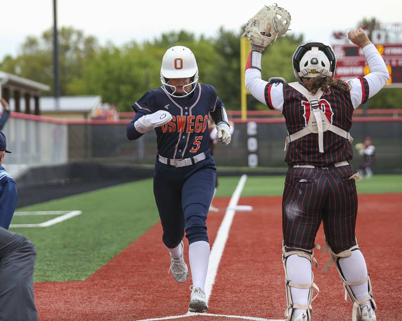 Oswego's Adalynn Fugitt (5) scores a run during softball game between Oswego at Yorkville. May 5, 2026 in Yorkville.